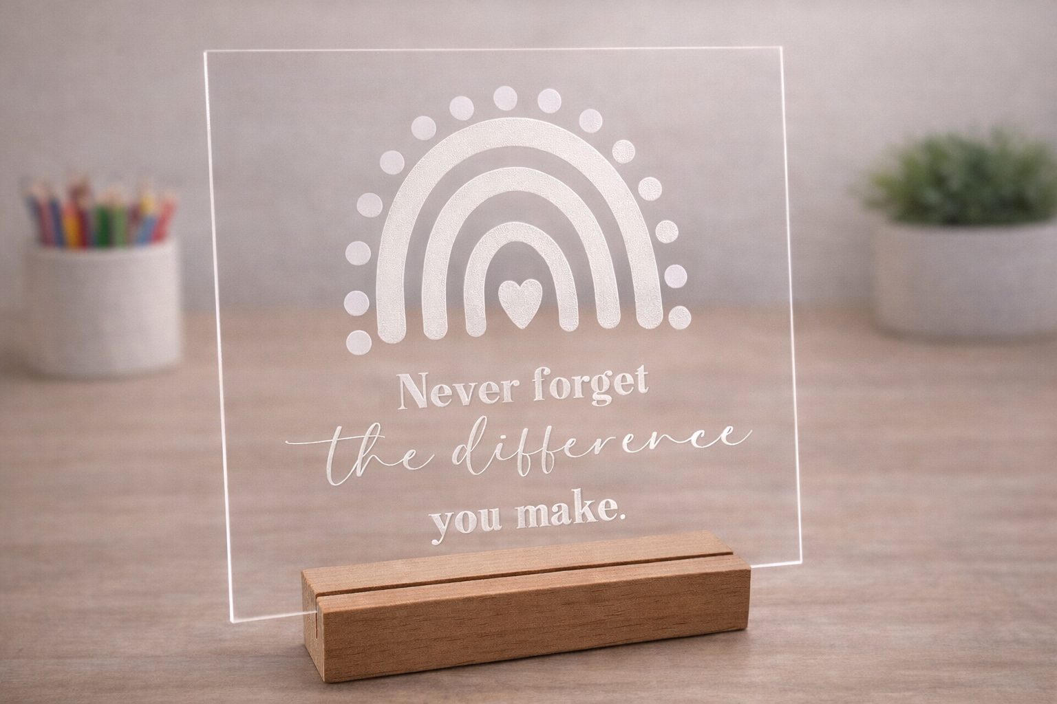 Clear acrylic teacher appreciation plaque with rainbow design and wooden stand