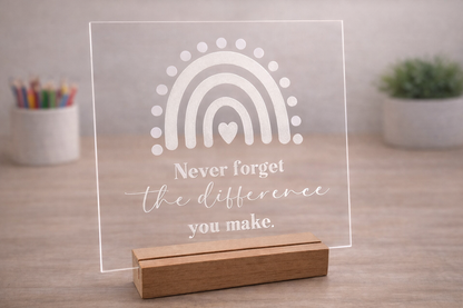 Clear acrylic teacher appreciation plaque with rainbow design and wooden stand