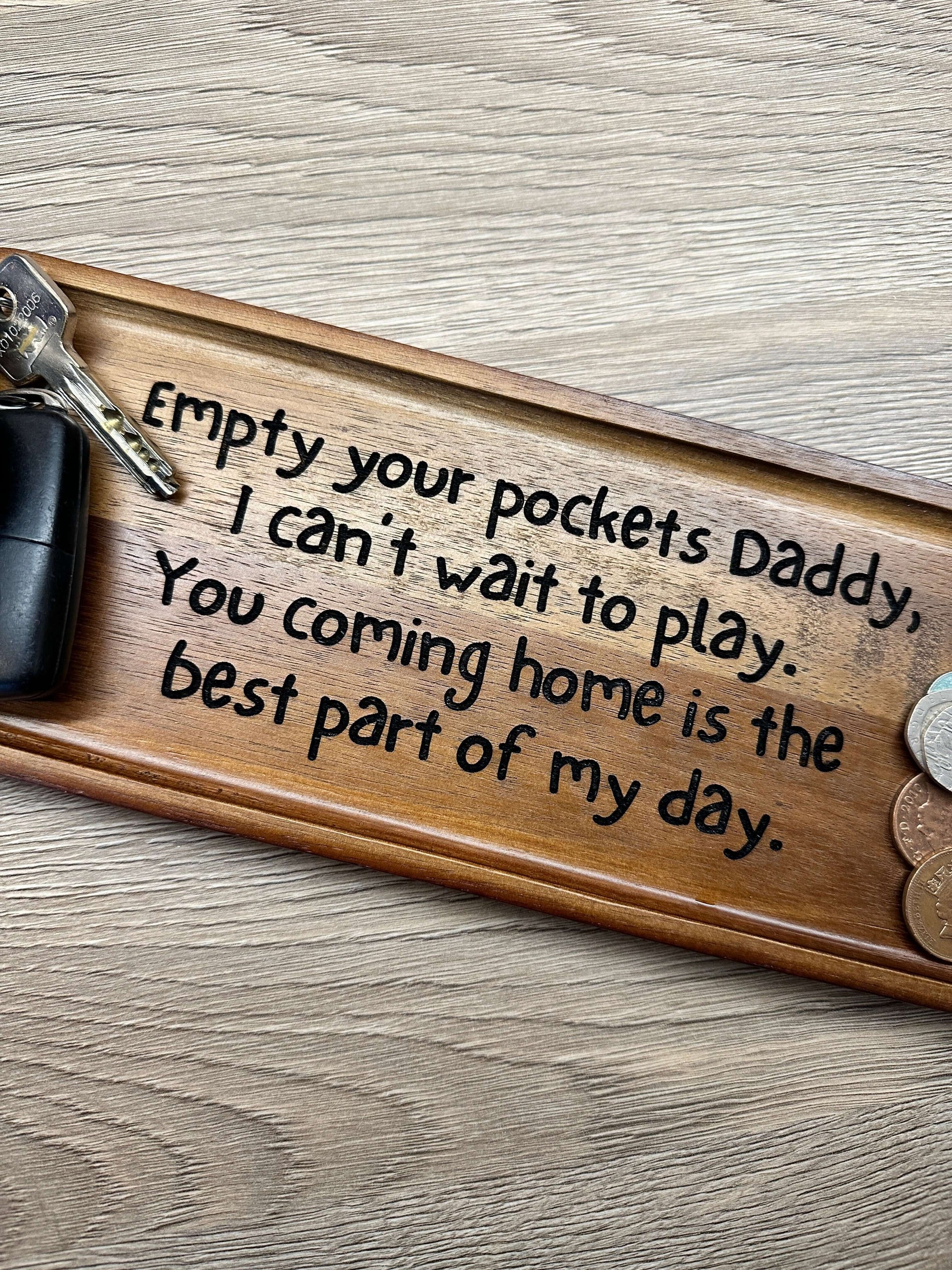 Wooden key organisation tray with an engraved personalised message. 