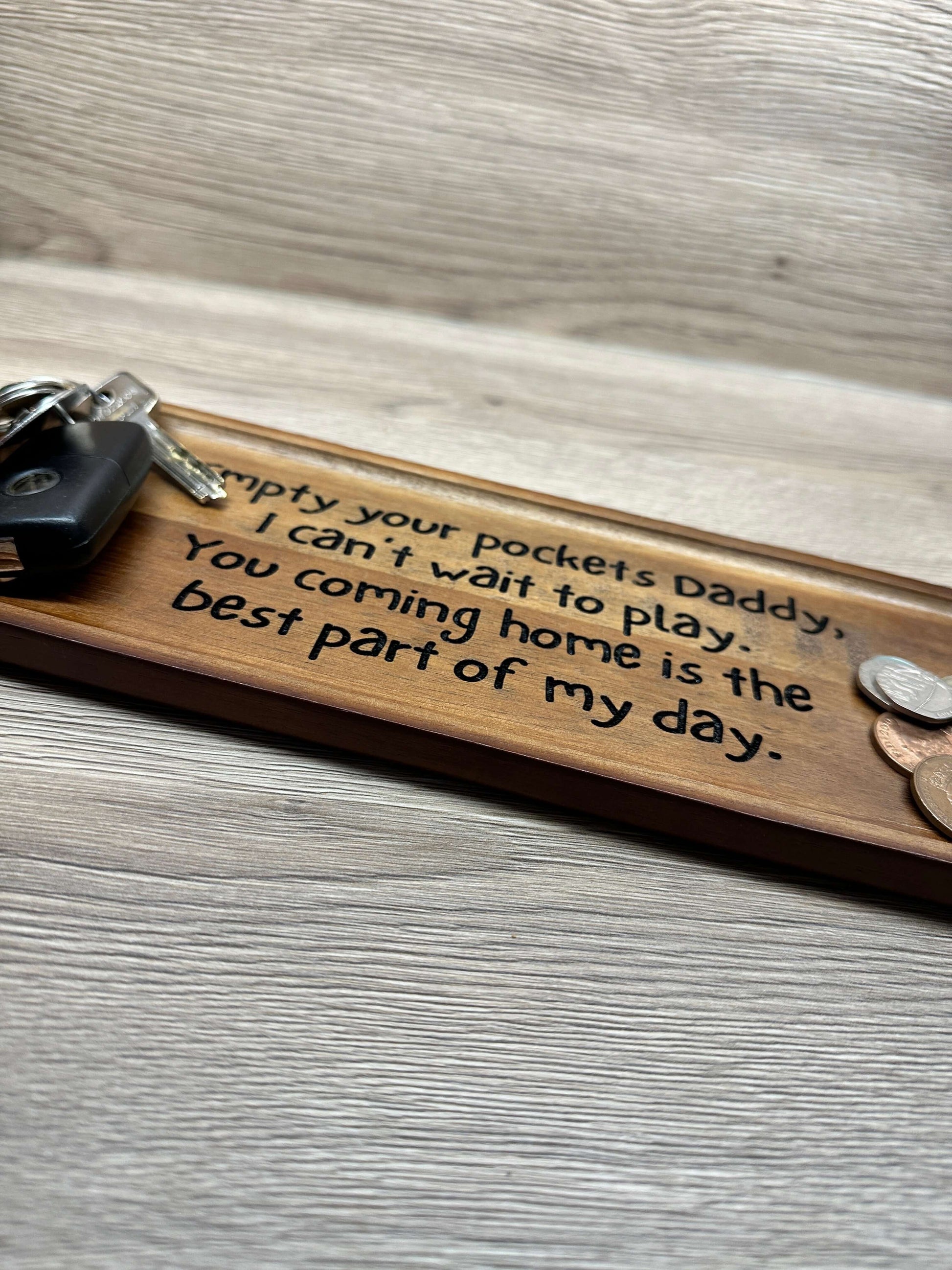 Wooden key organisation tray with an engraved personalised message. 