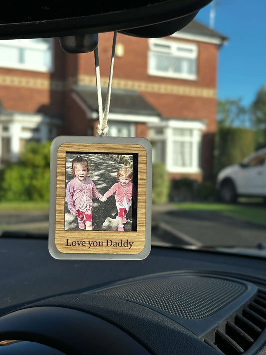 Wooden car hanging accessory including photo & engraving on the back.